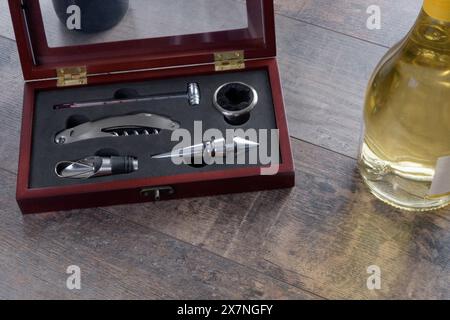 A classic set of attributes for bottled wine. Thermometer, corkscrew, lids and more Stock Photo