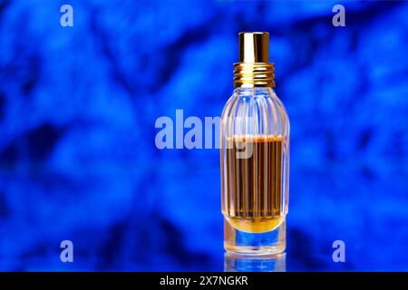 Exquisite perfume in the original jar on a beautiful background Stock Photo