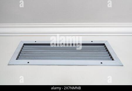 Ventilation grill in the room. Built-in air conditioner. Stock Photo