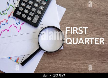 Top view image text FIRST QUARTER on office desk. First quarter concept. Stock Photo