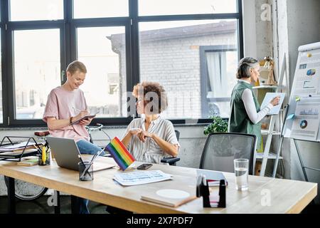 Cheerful diverse female professionals working together on their project in office. Stock Photo