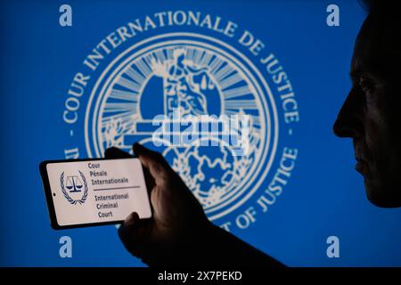 The International Court of Justice (ICJ) logo is displayed on a smartphone with ICJ seal visible in the background in this photo illustration. Taken in Brussels, Belgium. On May 20, 2024. (Jonathan Raa / Sipa USA) *** Strictly for editorial news purposes only *** Stock Photo