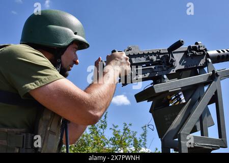 May 16, 2024, Zaporizhzhia, Ukraine: A Ukrainian serviceman of mobile air defence unit of Ukraine's 141st separate infantry brigade guards with the heavy machine gun Browning M2 on duty in Zaporizhzhia region. The effectiveness of Russian missile strikes on Ukraine has seen a dramatic spike recently as Ukraine's ammunition for its air defense systems dwindled due to delay in aid. Russia has ramped up its shelling and used more ballistic missiles to take advantage of Ukraine's lack of ammunition for its Patriot air defense systems. Russia often uses the cheaply produced drones to test air defen Stock Photo