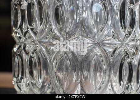 crystal vase fragment, abstract glass installation, transparent empty vase, play of light and shadow on the walls of a crystal vase Stock Photo