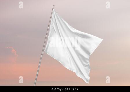 Clean white flag mockup waving in the wind, ideal for national flag, advertising and presentation designs with clear texture Stock Photo