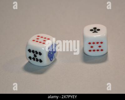 Playing dice with faces featuring Poker symbols, Stock Photo