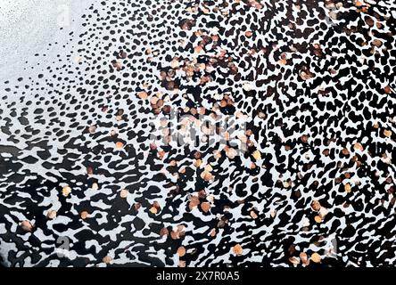 An intimate landscape scene capturing the mesmerizing foam patterns and birch leaves trapped in the foam of a serene pond during springtime, highlight Stock Photo