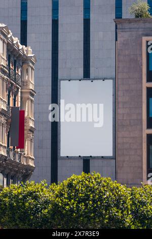Blank billboard on a building facade in the heart of Madrid for advertising mockup Stock Photo