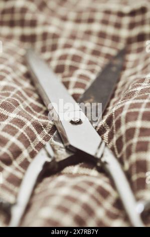 Old scissors on fabric Stock Photo