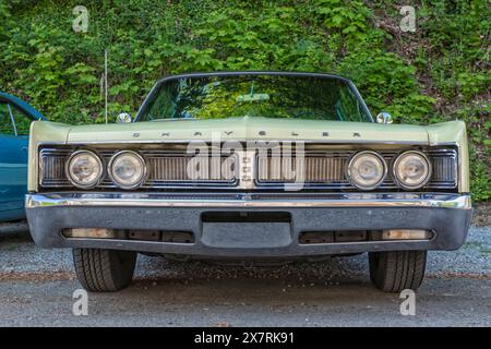 Stade, Germany �C May 11, 2024: Low angle frontal view of a light green Chrysler Newport 2-door Hardtop from 1967 displayed at Mopar Spring Fling meeti Stock Photo
