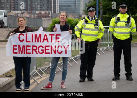 London, UK. 21 May, 2024. Climate activists protest outside the Annual General Meeting of oil giant Shell at the InterContinental Hotel in docklands, calling on the company to drop plans to expand extraction of the fossil fuels responsible for global heating if we are to meet Paris climate targets on CO2 reduction and temperature increases. In recent years the company has enjoyed record profits while consumers faced huge energy energy prices. Credit: Ron Fassbender/Alamy Live News Stock Photo