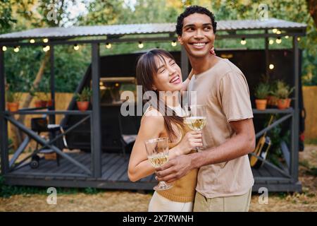 Affectionate young couple at camper van in rural landscape Stock Photo ...