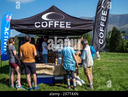 Customers at the 'Moon and Sixpence' Coffee van with Skiddaw in the background, Crow Park, Keswick, Lake District National Park, Cumberland, UK Stock Photo