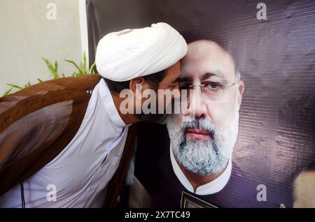 May 21, 2024, Peshawar, Pakistan: Reactions in Pakistan after Iranian President Raisi died in a helicopter crash. Dr. Hussain Chakami Director of the Republic of Iran Peshawar People pray at the mourning Iranian Cultural Center after the death of Iran's President Raisi and Foreign Minister Amir Abdullahian in Peshawar, Pakistan. Iran's President Ebrahim Raisi, Foreign Minister Hossein Amir-Abdollahian and several others were killed in a helicopter crash on 19 May 2024, after an official visit in Iran's northwest near the border with Azerbaijan, the Iranian government confirmed. (Credit Image: Stock Photo