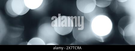 Blurred lights, gray, deep blue background, banner texture. Abstract bokeh with soft light header. Wide screen wallpaper. Panoramic web banner with co Stock Photo