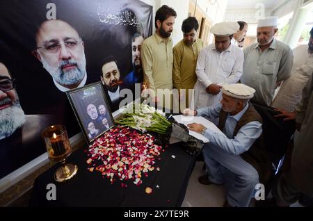 May 21, 2024, Peshawar, Peshawar, Pakistan: Reactions in Pakistan after Iranian President Raisi's death in helicopter crash.PESHAWAR, PAKISTAN, MAY, 21: Dr. Hussain Chakami Director of the Republic of Iran Peshawar People pray at the mourning Iranian Cultural Center after the death of Iran's President Raisi and Foreign Minister Amir Abdullahian on May 20, 2024 in Peshawar, Pakistan. Iran's President Ebrahim Raisi, Foreign Minister Hossein Amir-Abdollahian and several others were killed in a helicopter crash on 19 May 2024, after an official visit in Iran's northwest near the border with Azer Stock Photo