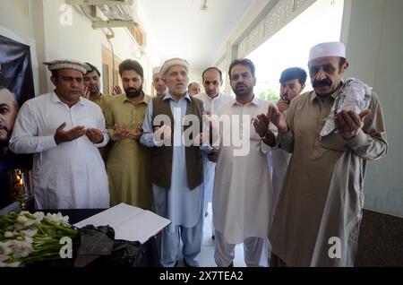 May 21, 2024, Peshawar, Peshawar, Pakistan: Reactions in Pakistan after Iranian President Raisi's death in helicopter crash.PESHAWAR, PAKISTAN, MAY, 21: Dr. Hussain Chakami Director of the Republic of Iran Peshawar People pray at the mourning Iranian Cultural Center after the death of Iran's President Raisi and Foreign Minister Amir Abdullahian on May 20, 2024 in Peshawar, Pakistan. Iran's President Ebrahim Raisi, Foreign Minister Hossein Amir-Abdollahian and several others were killed in a helicopter crash on 19 May 2024, after an official visit in Iran's northwest near the border with Azer Stock Photo