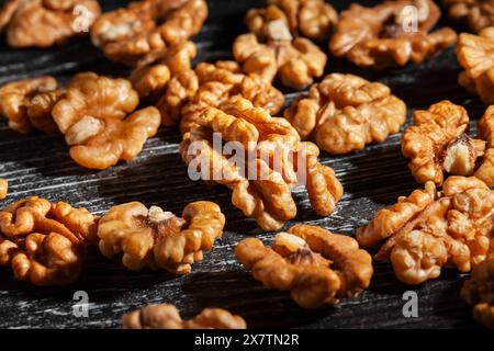 walnuts on black wood background Stock Photo