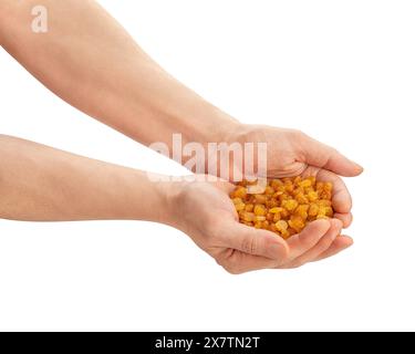 yellow raisins  in hand path isolated on white Stock Photo