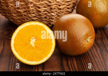 sliced chocolate oranges on wood background Stock Photo