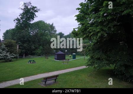 Police next to a black forensics tent in Grenfell Park, Maidenhead where Matthew Trickett was found dead on Sunday, he had been accused of assisting the Hong Kong intelligence service. Picture date: Tuesday May 21, 2024. Stock Photo