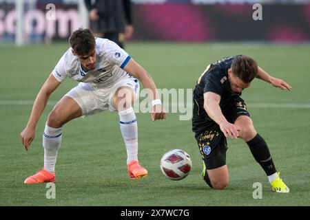 Lausanne, Switzerland. 21 May, 2024:  Haithem Loucif (defender) of FC Lausanne-Sport #13 tackles Florian Hoxha (defender) of Grasshopper Club Zürich #73 during  FC Lausanne Sport vs Grasshopper Club Zürich at  Tuiliere Stadium in Lausanne. Credit: Patrick Dancel/Alamy Live News Stock Photo