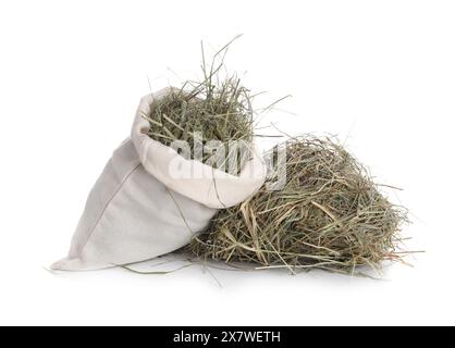 Dried hay in burlap sack isolated on white Stock Photo