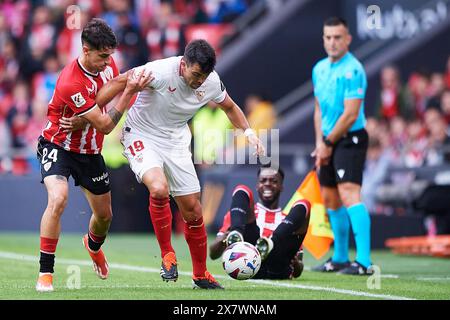 Marcos Javier Acuna of Sevilla FC compete for the ball with Benat Prados of Athletic Club during the LaLiga EA Sports match between Athletic Club and Stock Photo