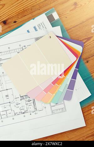 Color, swatch and planning home renovation with blueprint on table from above with interior design. Creative, moodboard and decision for project in Stock Photo