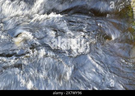 Abstract patterns made by swirl of salmon jumping up the fish ladder Pitlochry,Perthshire, Scotland Stock Photo