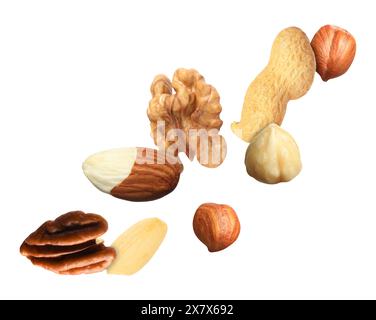 Many different nuts in air on white background Stock Photo