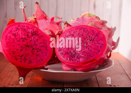 Red dragon fruit that is ripe and ready to be served on a plate is good for your health Stock Photo