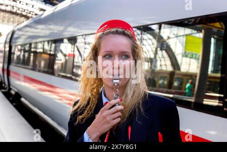 With a whistle, a Deutsche Bahn employee gives the train driver the signal to depart, Berlin, 03/07/2014, Berlin, Germany, Europe Stock Photo