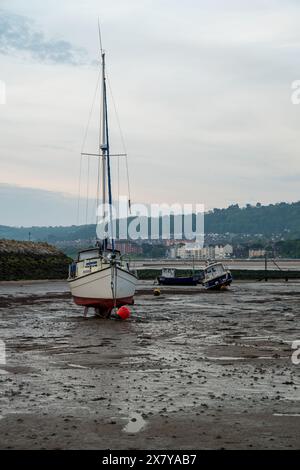 RHOS-ON-SEA, WALES, UNITED KINGDOM - MAY 10 2024: Small boats moored in the harbour at Rhos-on-Sea, Wales, Uk at low tide. Stock Photo