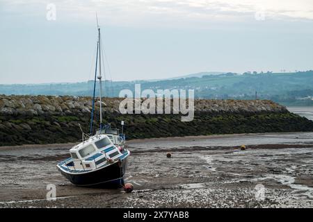 Small boats moored in the harbour at Rhos-on-Sea, Wales, Uk at low tide. Stock Photo