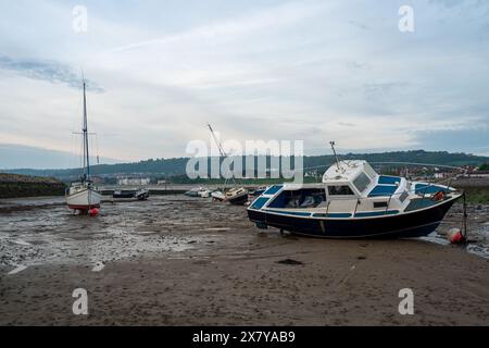 Small boats moored in the harbour at Rhos-on-Sea, Wales, Uk at low tide. Stock Photo