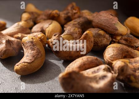 Roasted cashew nuts with shells Stock Photo