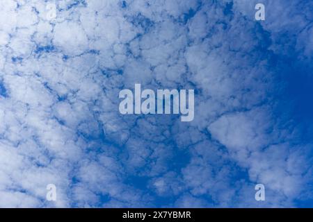 Blue sky with fluffy clouds, texture background Stock Photo