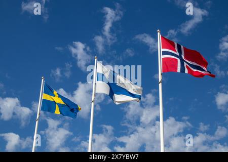 National flags of Sweden, Finland and Norway waving in the wind Stock Photo
