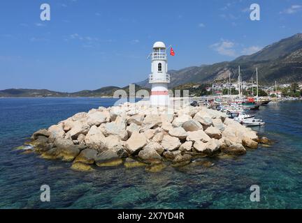 KAS, ANTALYA, TURKEY-AUGUST 10,2018:Kas Lighthouse and Boats with Blue Sky Background Stock Photo