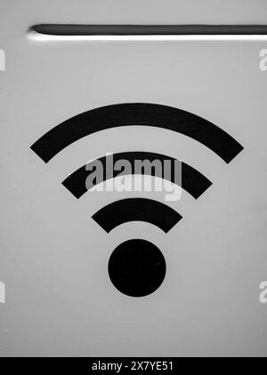 Black Wi-Fi symbol on light gray background. Stock Photo