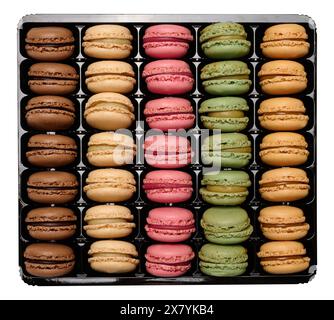 Multi-colored macarons in a plastic box, top view. Assortment. Isolated background Stock Photo