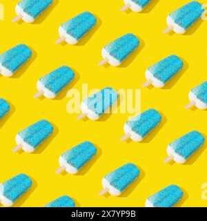 Trendy sunlight blue glazed ice cream popsicle pattern on yellow background. Minimal summer concept. Ice cream aesthetic. Stock Photo