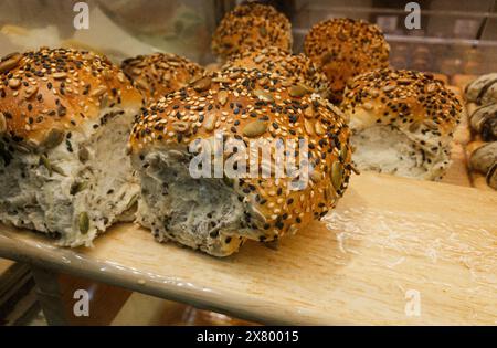 Close-up healthy bread or bun with sesame seed and sunflower seed on the shelf in the bakery store Stock Photo