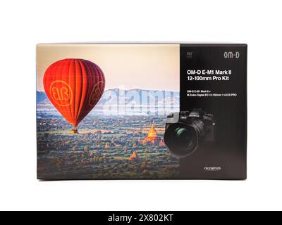 BUCHAREST, ROMANIA - AUGUST 21, 2020. Box of Olympus OM-D E-M1 Mark II digital camera and 12-100mm pro kit lens, isolated on white Stock Photo
