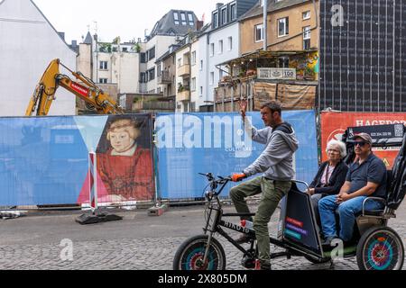 construction fence with painting by Hans Cranach at the construction site of the extension of the Wallraf-Richartz-Museum in the old town, tourists on Stock Photo