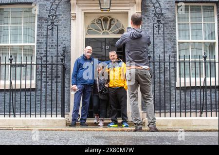 London, England, UK. 22nd May, 2024. FIGEN MURRAY, mother of Manchester Arena bombing victim Martyn Hett, arrives in Downing Street, London with (husband and daughters, to hand in a letter about Martyn's Law to Number 10, after her 200-mile walk to London from the spot where her son was killed in Manchester. Martyn's Law is named in tribute to the 29-year-old who was one of 22 people killed at the end of an Ariana Grande concert in May 2017, would require venues and local authorities in the UK to have preventative plans against terror attacks. Credit: ZUMA Press, Inc./Alamy Live News Stock Photo