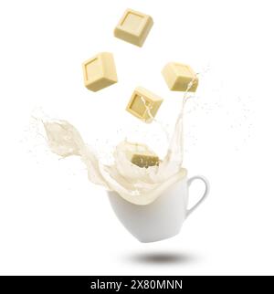 White chocolate blocks splashing into cup with cream, isolated on white background. Stock Photo