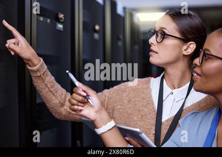 Programming, server and people with maintenance of technology and technician with teamwork in IT. Datacenter, repair and programmer problem solving to Stock Photo