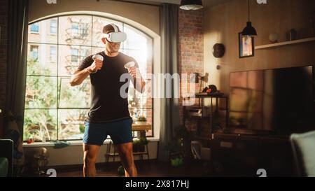 Futuristic Metaverse Home Gym: Strong Athletic Black Man Exercising While Wearing Virtual Reality Headset. Muscular Mixed Race Sportsman Boxing and Staying Connected Using VR Workout Service Stock Photo
